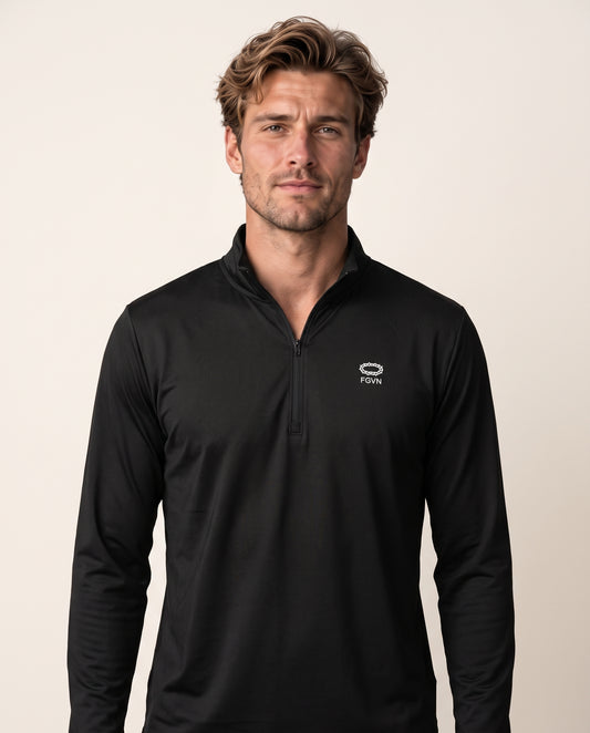 Alex wears a black quarter-zip in a front-facing photograph.