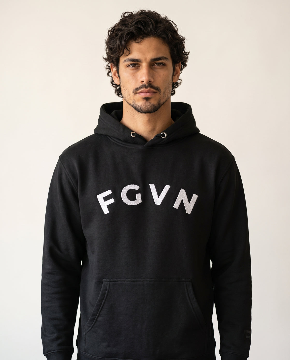 Diego wears a black hoodie in a front-facing photograph.