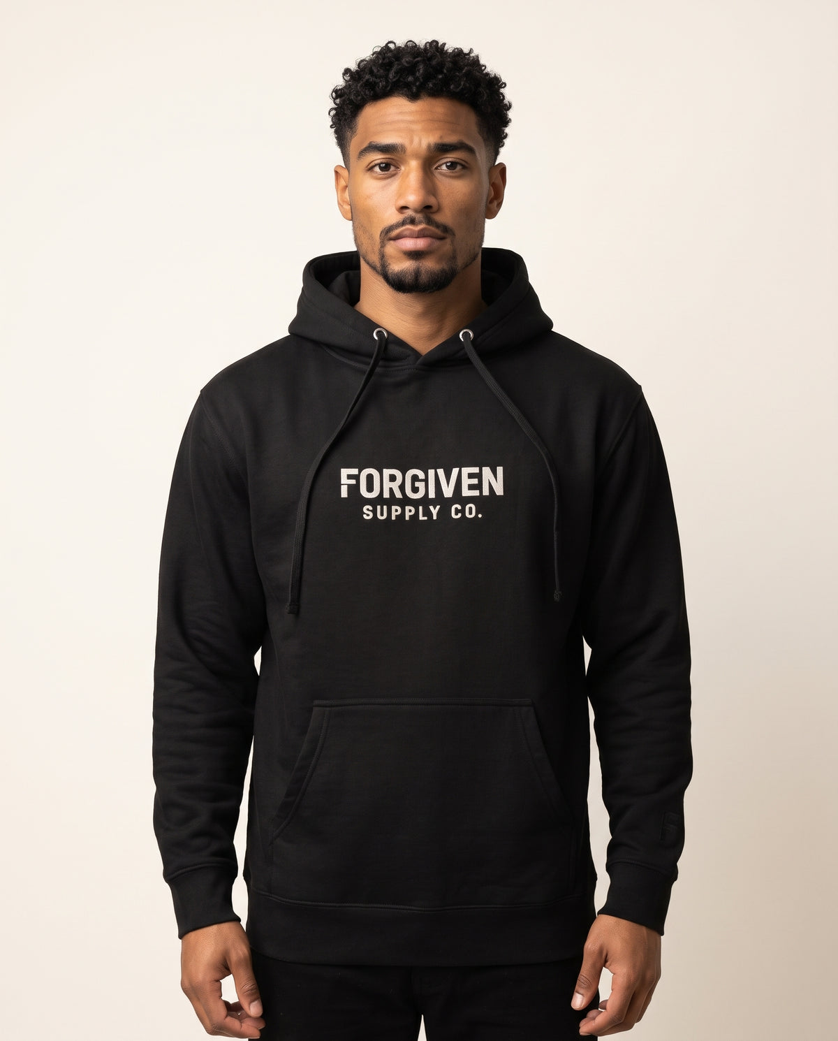 Marcus wears a black hoodie in a front-facing photograph.
